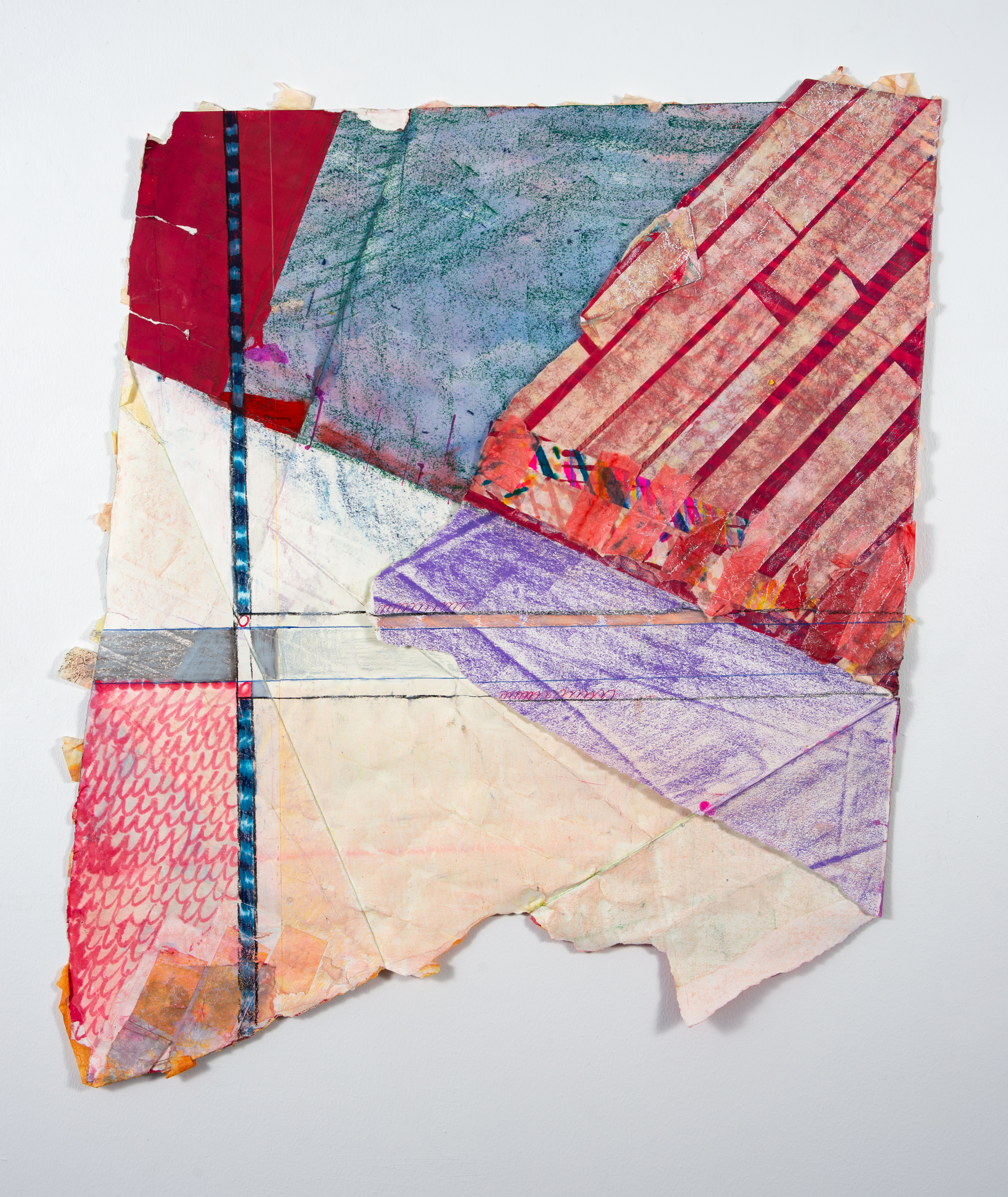 Irregular shape of folded paper has geometric blocking of reds, blues, and purples. Lines build pattern and intersect in a grid-like form in the bottom left.